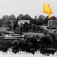 Lock-Uo (at finger) and Town Hall from across Sixteen Mile Creek